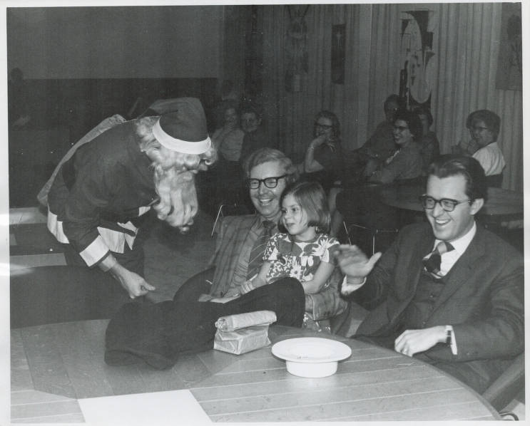 Santa visiting CTS staff, faculty, and families at 1969 party.