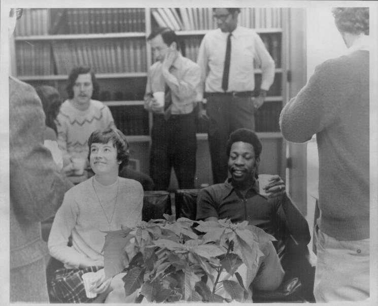 Students mingle and smile at seminary Christmas party in 1972.