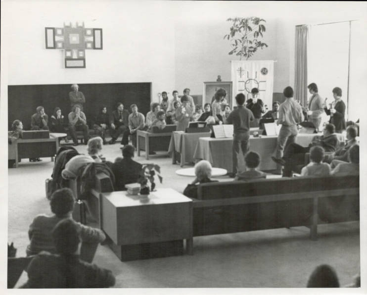 Bell choir performs at seminary Christmas party in front of group in 1973.