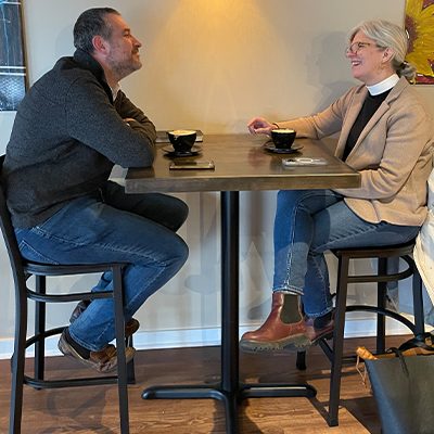 Former CTS students Rev. Patrick Burke (Episcopal priest at St. Paul’s Episcopal Church in Indianapolis) and Kristin White (staff member of the Episcopal Dioceses of Indianapolis) share a cup of coffee. The two were part of a CTS class with Eric LeSure and are supporters of The Avenue Coffeeshop and Café.