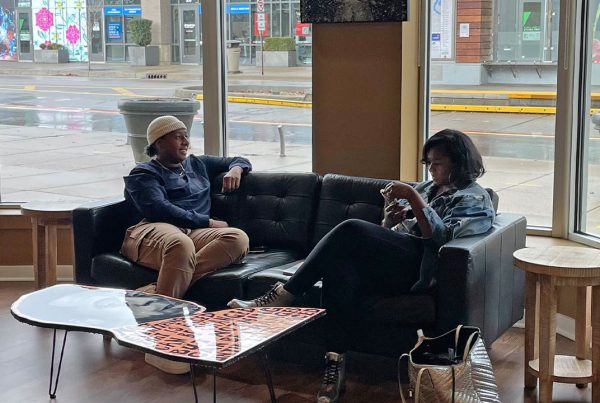 Two patrons enjoy a brief respite at the grand opening of The Avenue Coffeeshop and Café in Indianapolis.