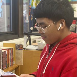 Taevon Chou reading a book