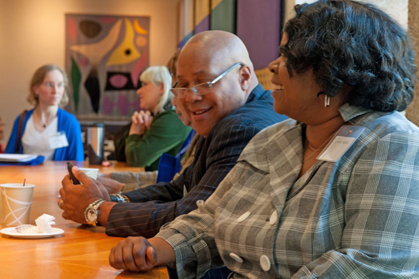 Lifelong Learning - Students having a conversation around the table.