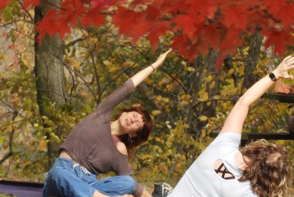 Yoga class outside under the trees