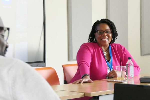 Dr. Courtney Buggs teaching the PhD class